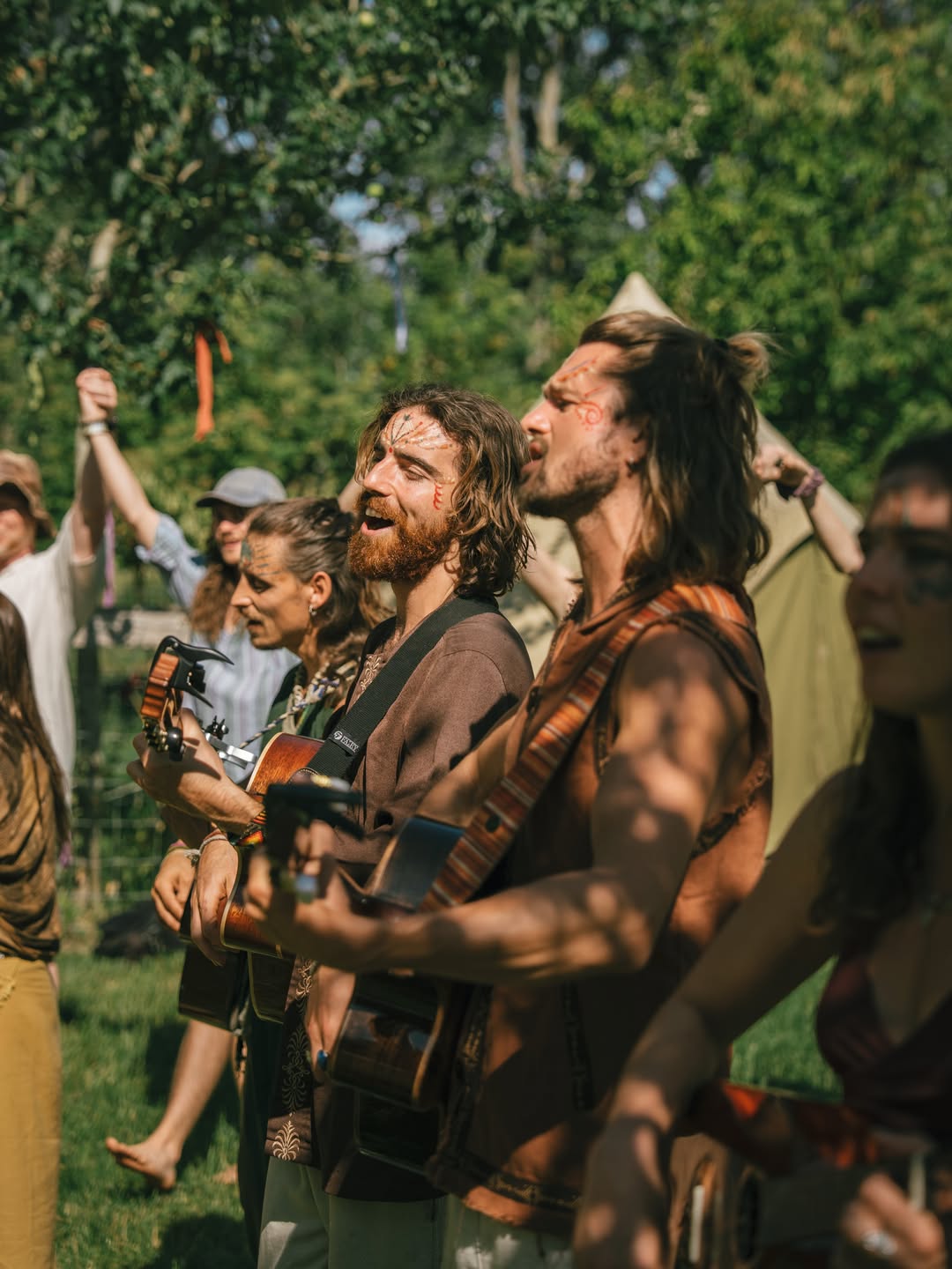Musicians singing and playing guitar at Shamballa